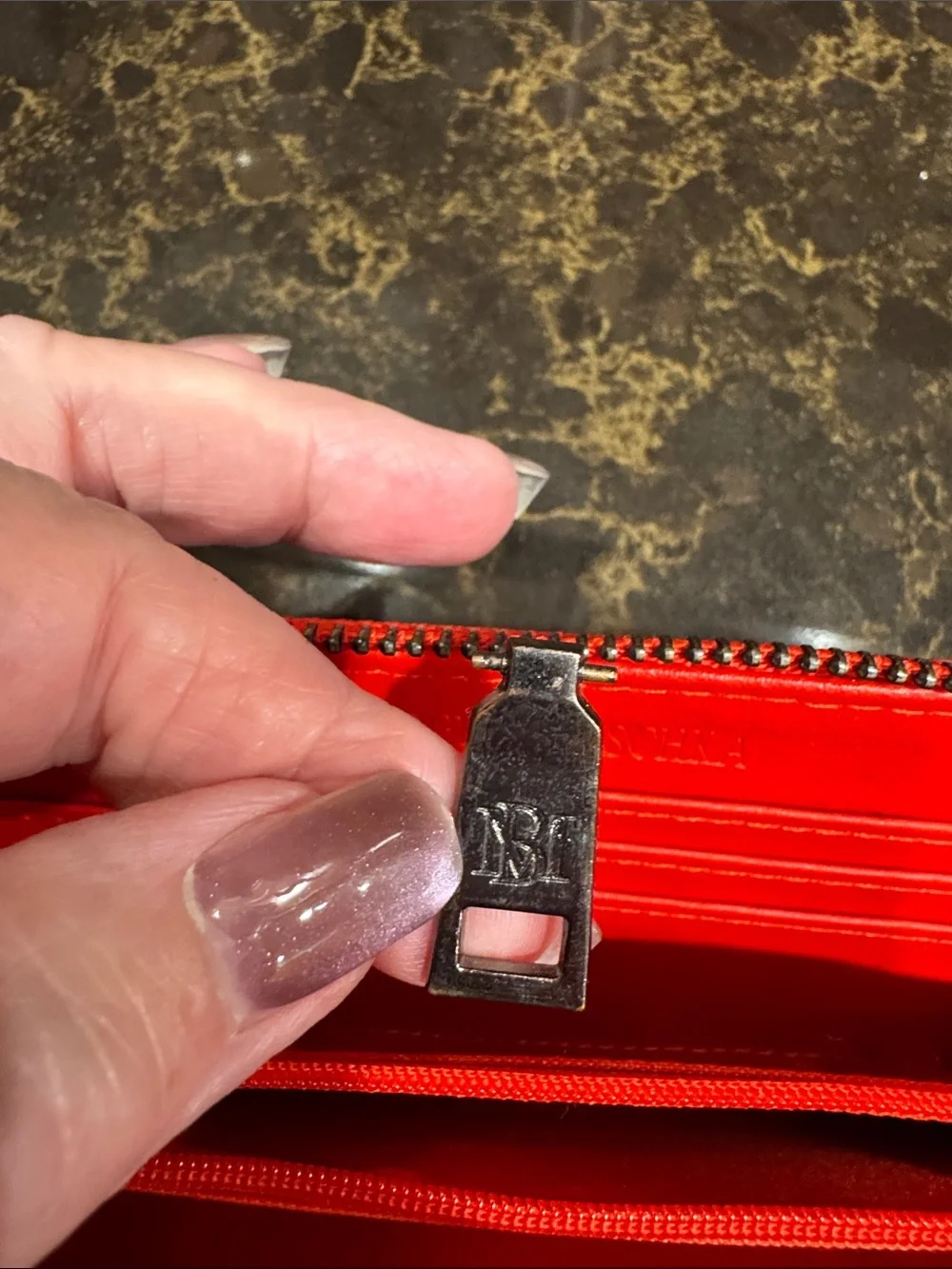 Badgley Mischka Red Zip Wallet with Embossed Logo zipper pull replaced